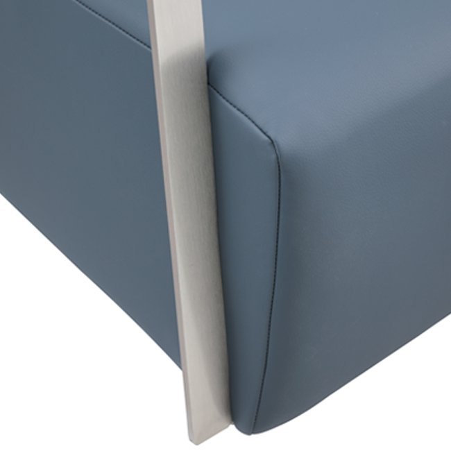 Modern lounge chair with deep blue upholstered seat and backrest, featuring sleek brushed metal armrests and minimalist design – ideal for commercial or hospitality interiors