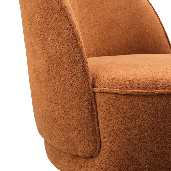 Curved back lounge chair in rich terracotta fabric with plush cushioning and a rounded base – a stylish, commercial-grade seating option built for durability in commercial hotels, lobbies, lounge or reception areas