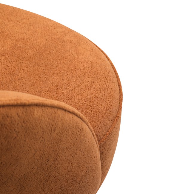 Curved back lounge chair in rich terracotta fabric with plush cushioning and a rounded base – a stylish, commercial-grade seating option built for durability in commercial hotels, lobbies, lounge or reception areas.