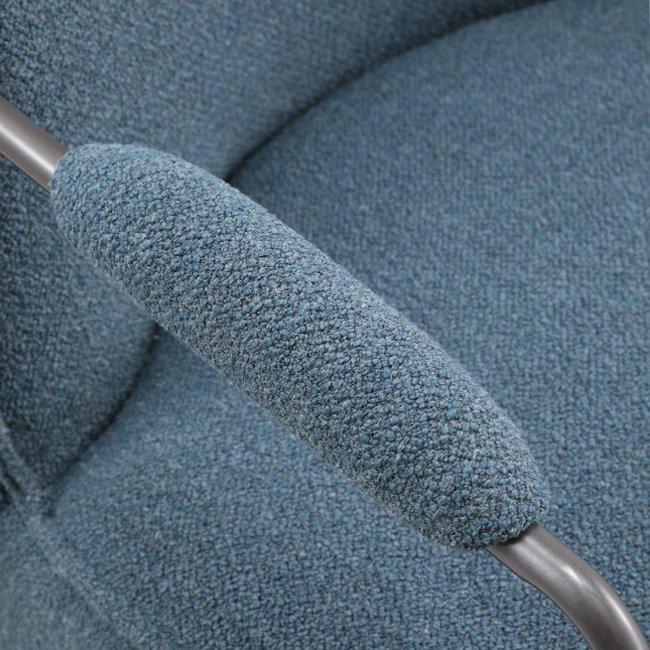 Modern blue lounge chair with curved backrest, textured upholstery, and cushioned metal armrests – a durable, commercial-grade seating solution ideal for commercial venues including hotels, pubs, gaming rooms, hospitality lounges, waiting areas, lobbies or reception areas